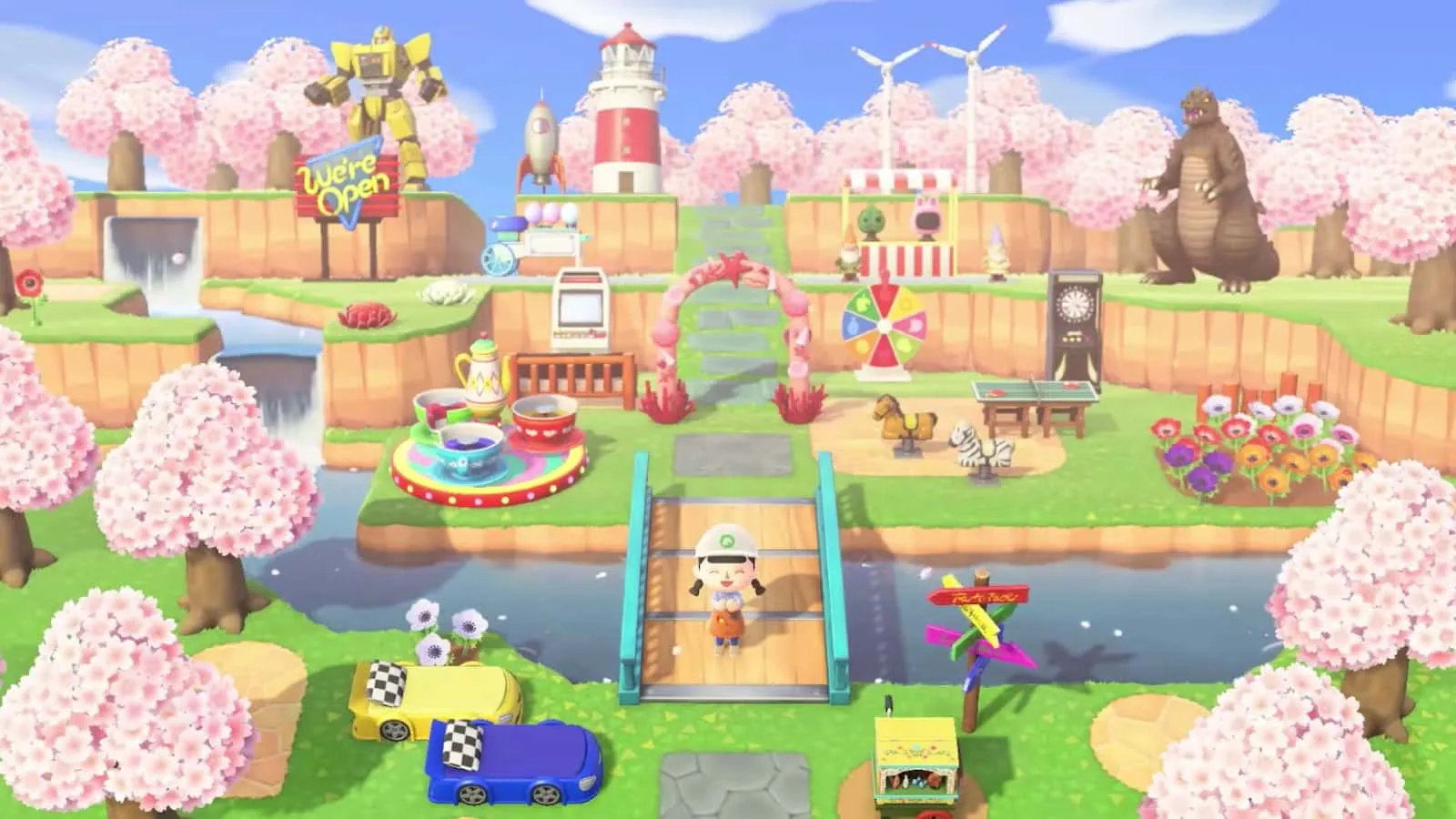 Una imagen de un personaje parado en medio de un colorido diseño de isla en Animal Crossing New Horizons.