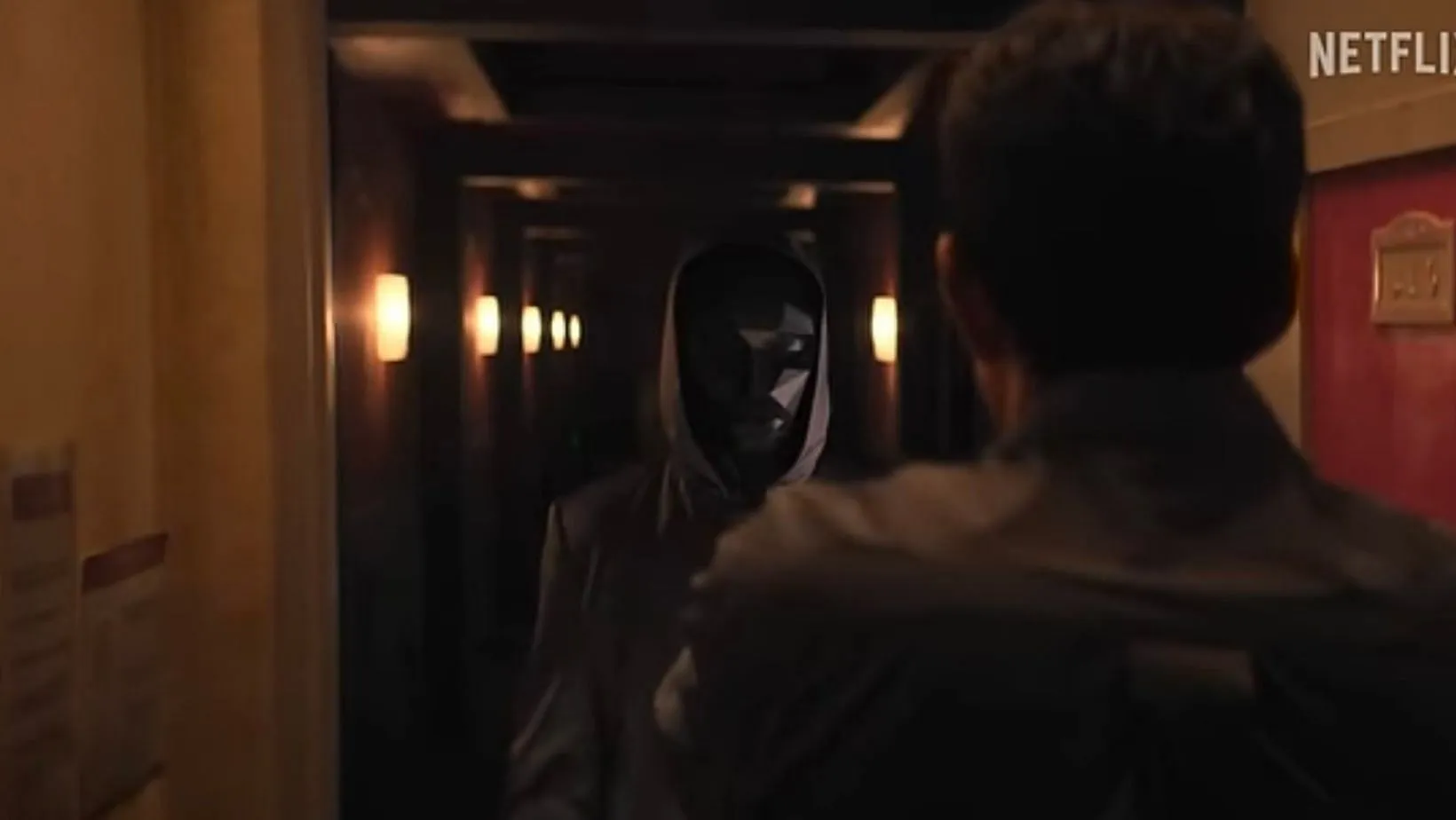 Front Man knocking on Seong Gi-hun's door with his mask on. (Image via X/@ironspdr)