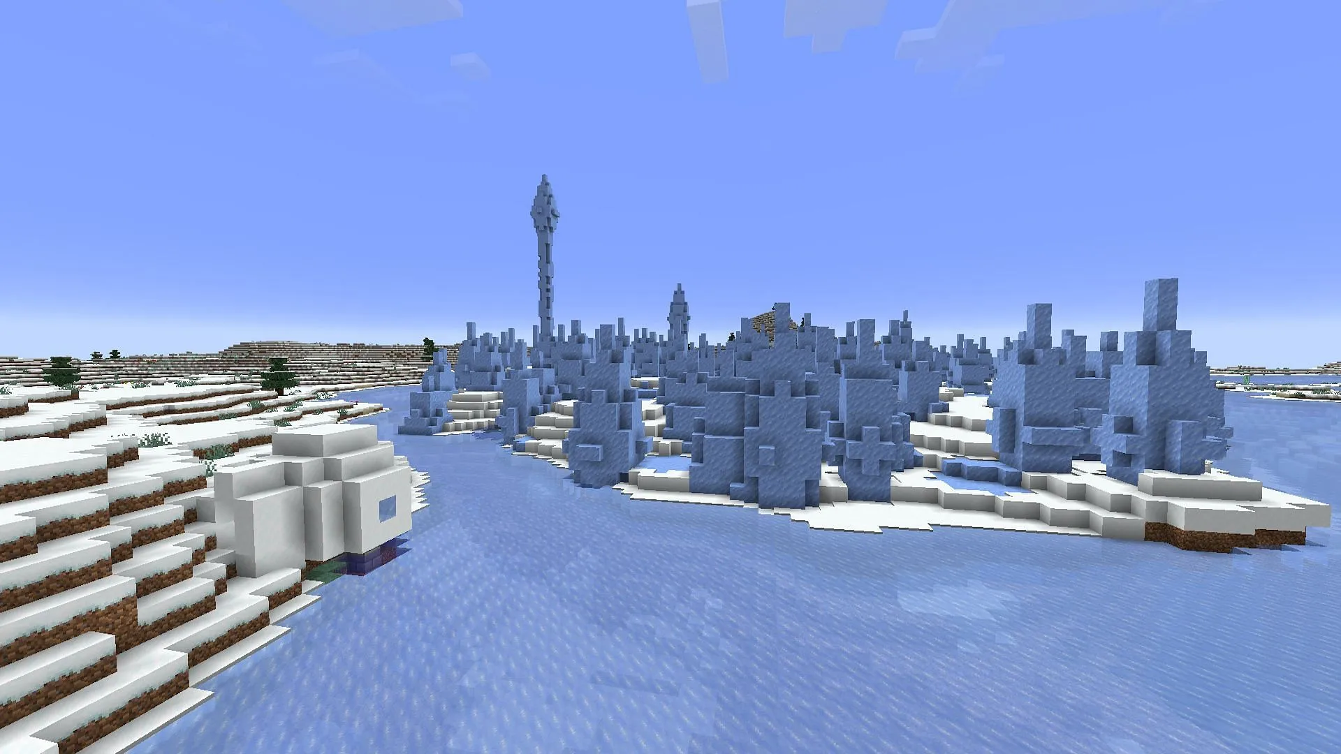 O bioma de picos de gelo e o iglu no porão foram encontrados ao norte do spawn (Imagem via Mojang)