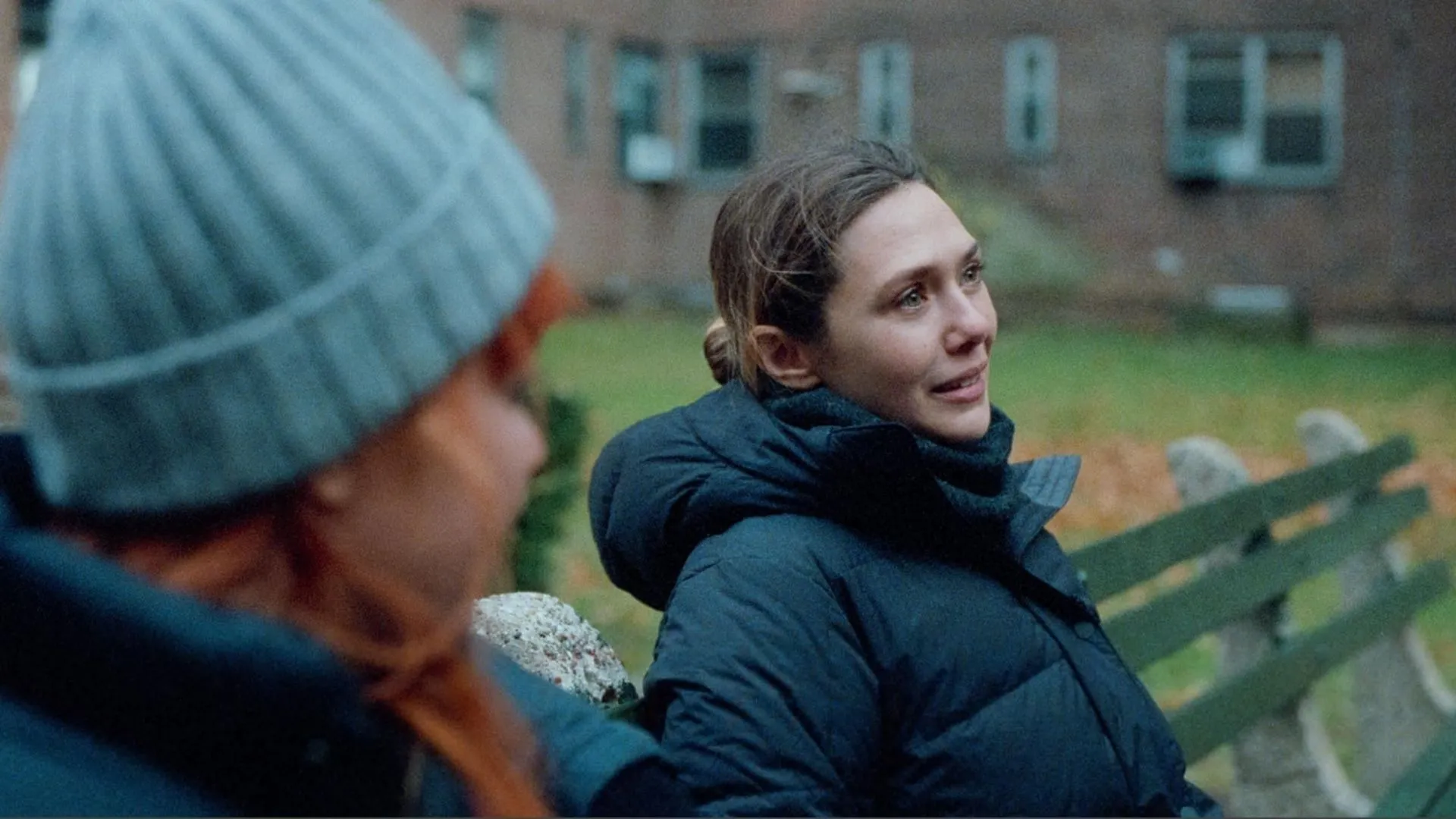 Elizabeth Olsen plays Christina in the film. (Image via Netflix)