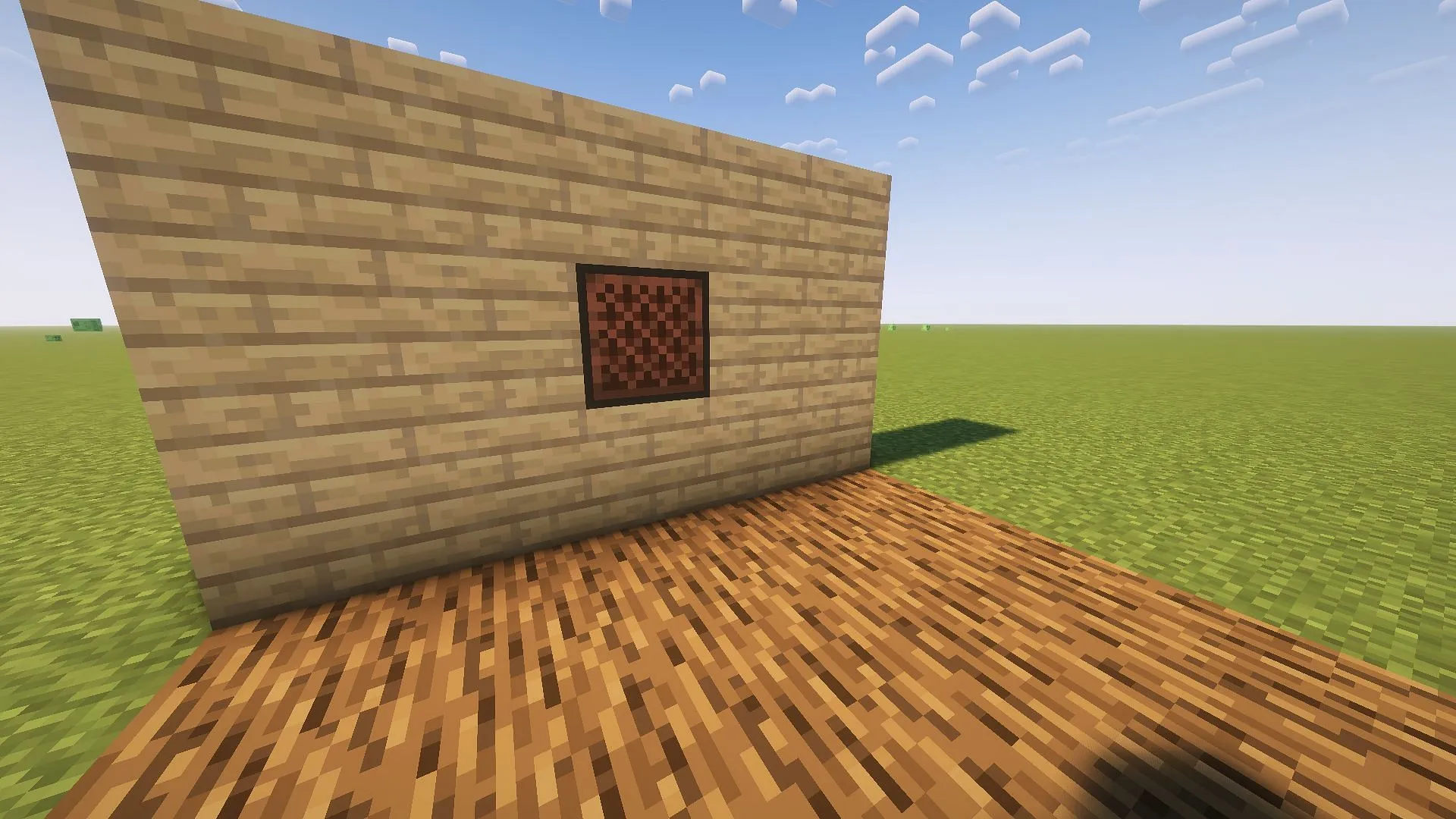 Start your Minecraft piano build with a jukebox embedded in a wall (Image via Mojang)