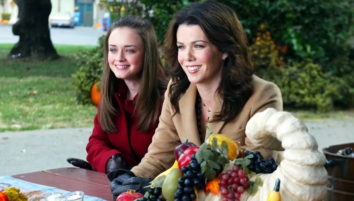 Rory and Lorelai Gilmore sit outside during Thanksgiving in Gilmore Girls