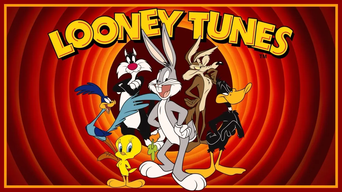 O elenco dos Looney Tunes em pé em frente ao fundo dos círculos da marca registrada