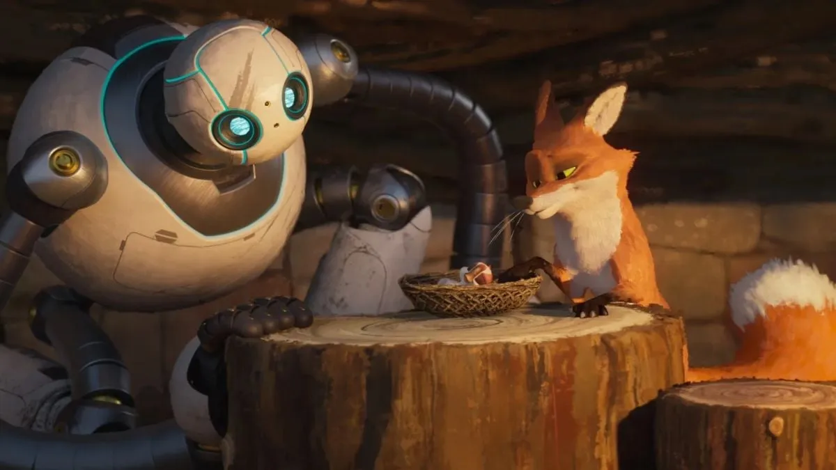 A robot and a fox sit at a round table to watch over a gosling in a scene from The Wild Robot.