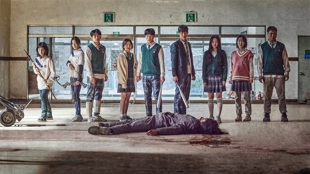 Teens crowd around a zombie's corpse in 'All of Us Are Dead'