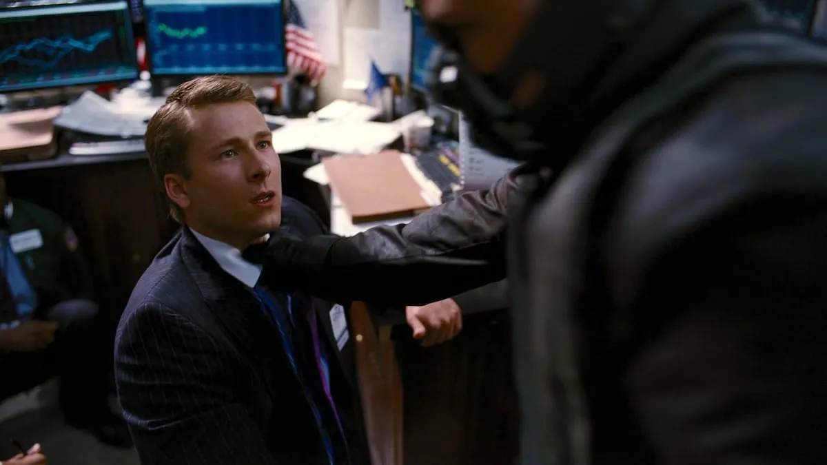 Glen Powell and Bane exchanging glances