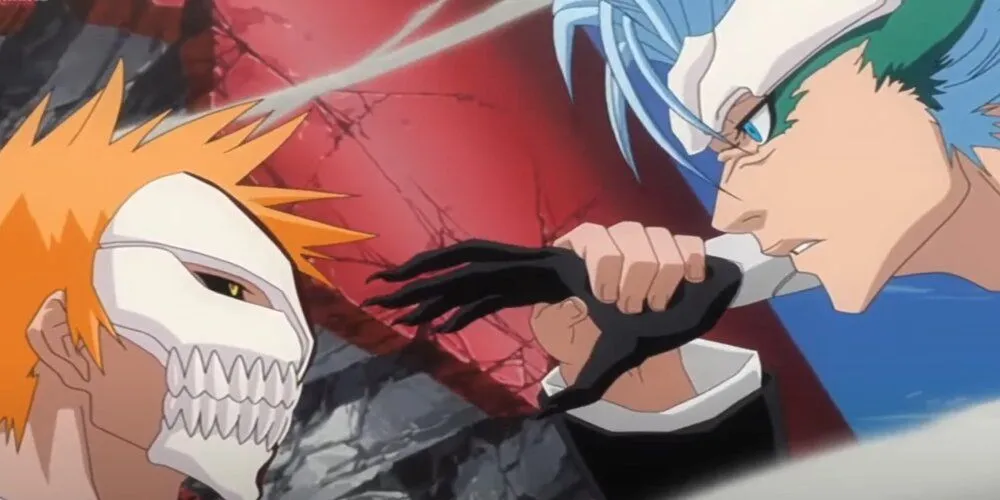 Ichigo with his mask activated holding back Grimmjow's punch