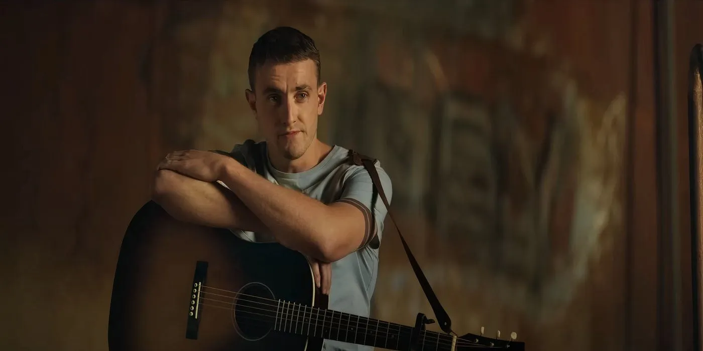 Aidan avec une guitare dans Carmen