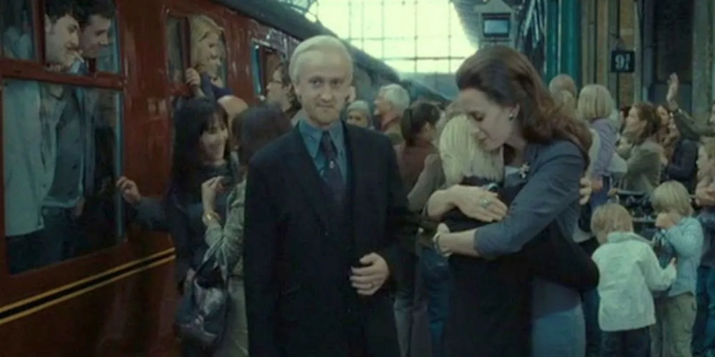 Draco Malfoy putting his son on the Hogwarts Express.