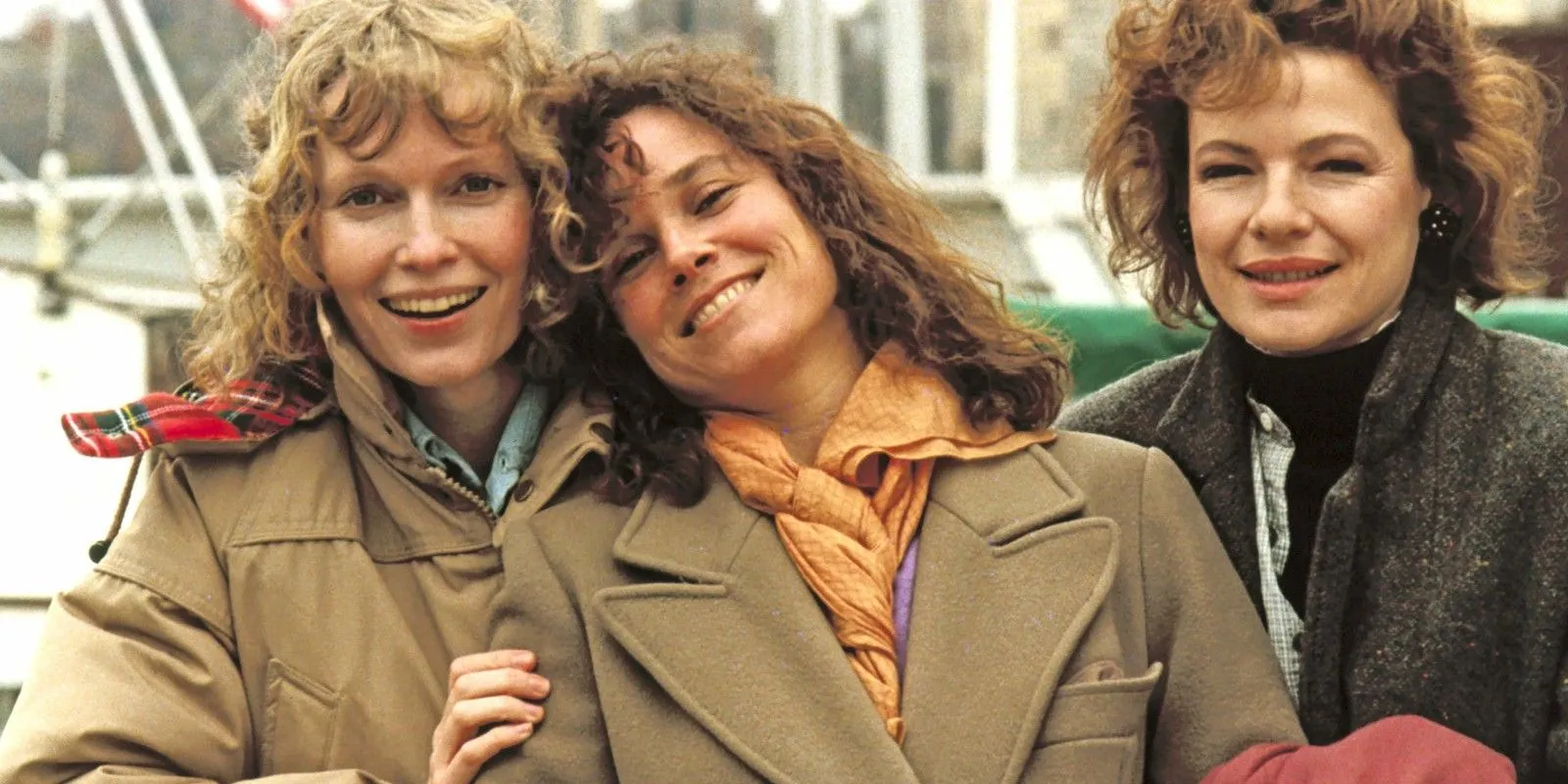 Mia Farrow, Barbara Hershey and Dianne Wiest smiling together in Hannah and Her Sisters