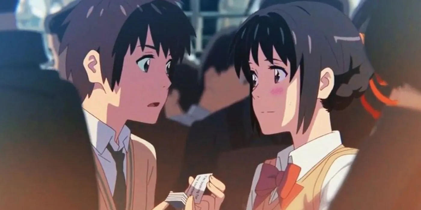 Taki und Mitsuha in Tokio lächeln sich an