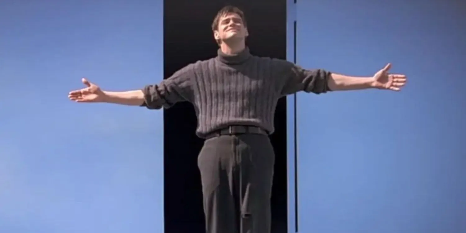 Truman Burbank avec les bras tendus dans The Truman Show