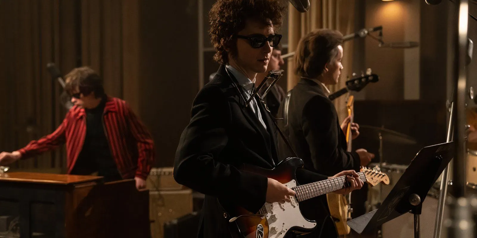 Bob Dylan performs with a band.