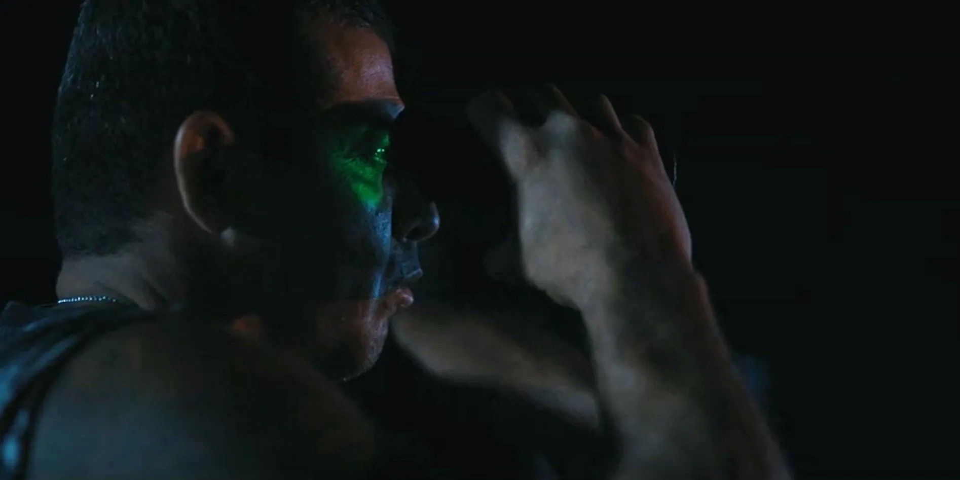 A cartel member spying with night vision binoculars in Landman episode 7