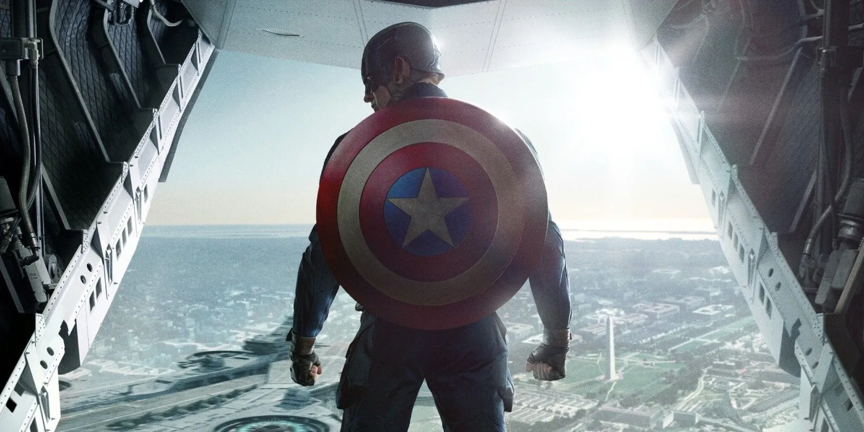 Chris Evans As Steve Rogers With Captain America Shield Standing On A Helicarrier In Captain America The Winter Soldier