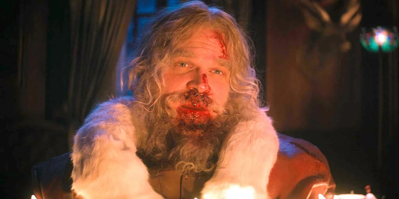 David Harbour as a bloodied Santa sitting down in Violent Night