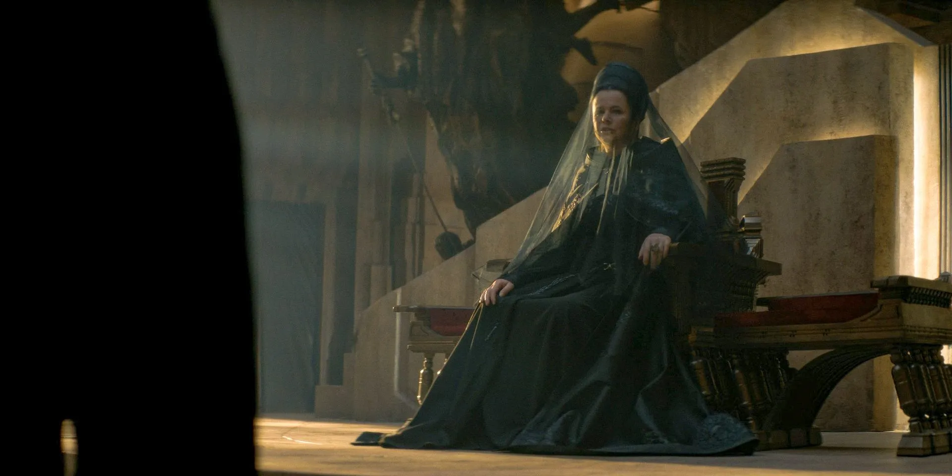 Valya (Emily Watson) sitting on Emperor Javicco Corrino's throne in Dune: Prophecy Season 1 Ep 6