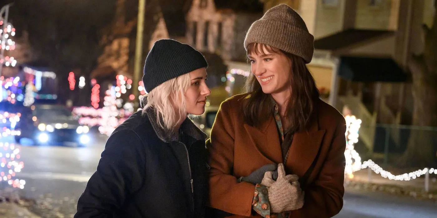 Kristen Stewart as Abby and Mackenzie Davis as Harper laughing in Happiest Season