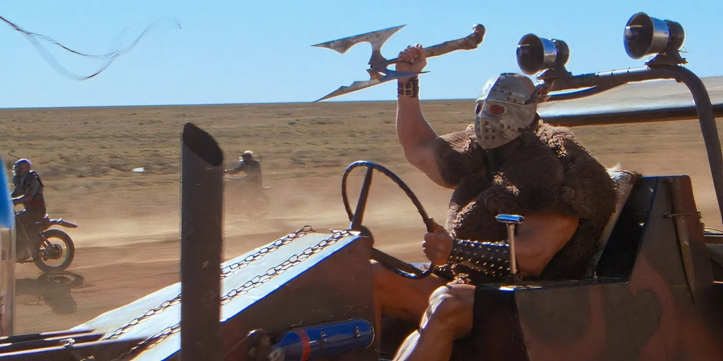 Lord Humungus (Kjell Nilsson) holds a spear while driving in Mad Max 2: The Road Warrior