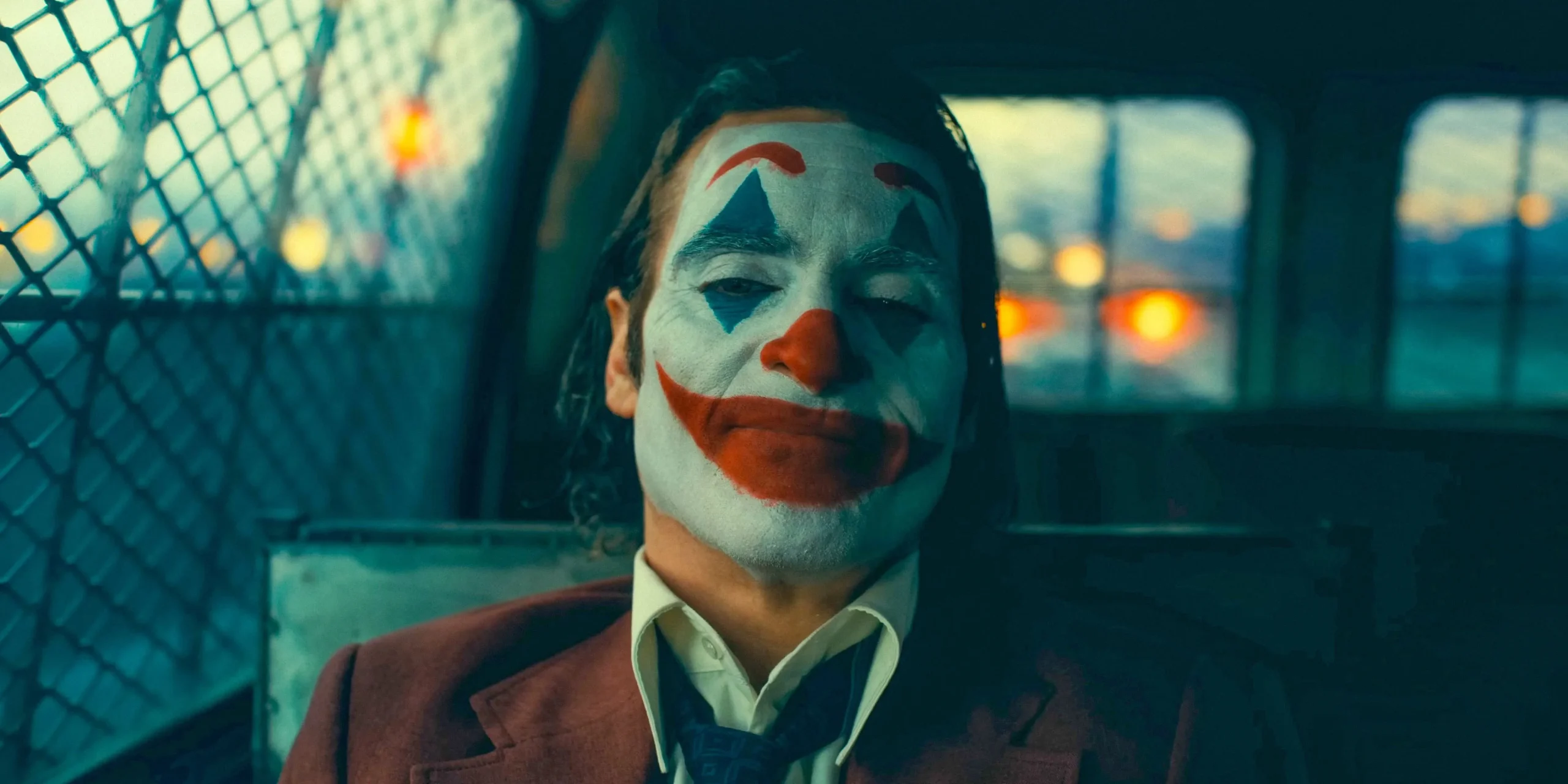 Joker sitting in a car in Joker: Folie a Deux