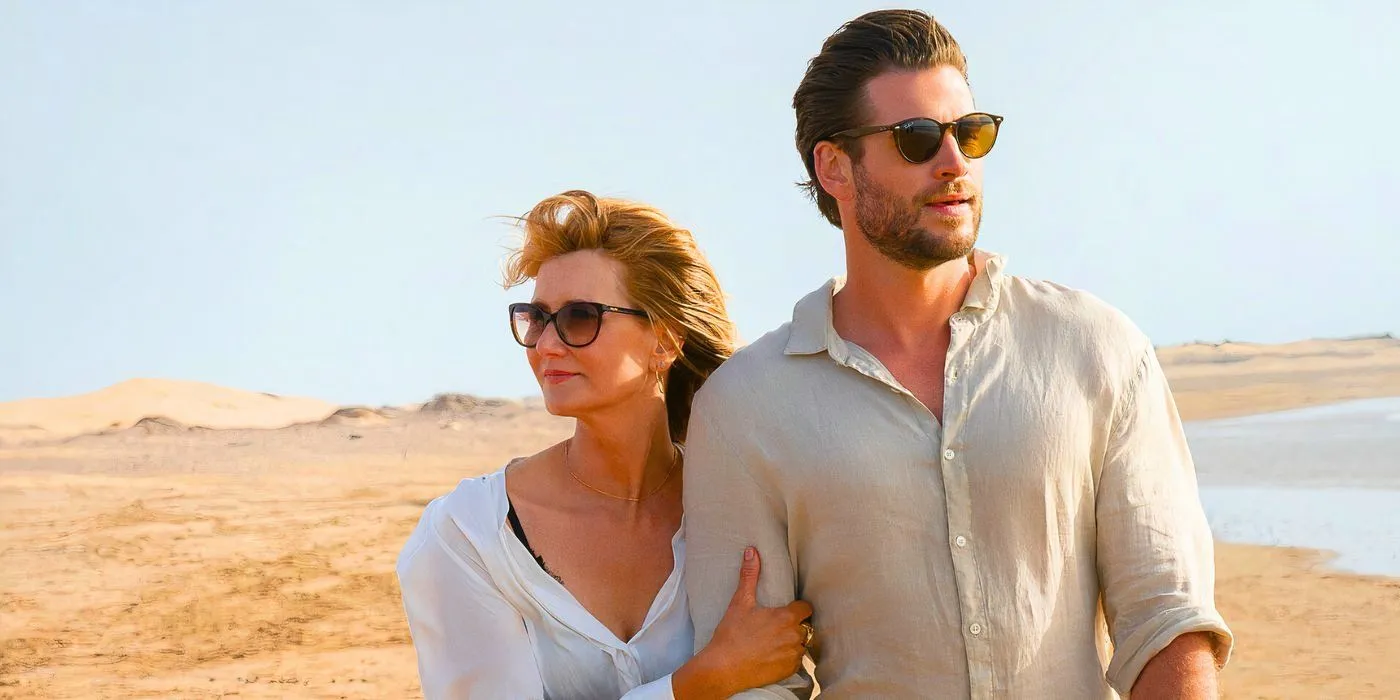 Laura Dern dans le rôle de Katherine et Liam Hemsworth dans le rôle d'Owen marchant sur la plage dans Lonely Planet