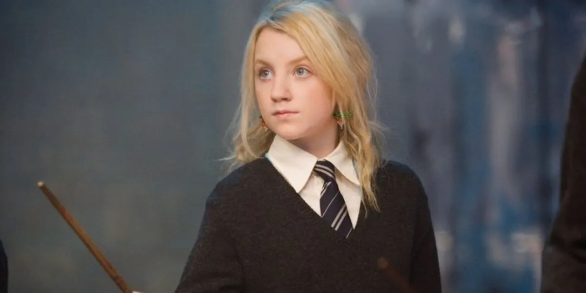 Luna Lovegood raising her wand in Harry Potter.