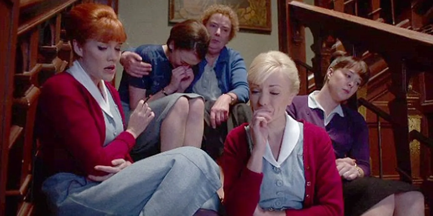 Patsy, Delia, Barbara, Trixie and Phyllis sit on the steps in Call the Midwife