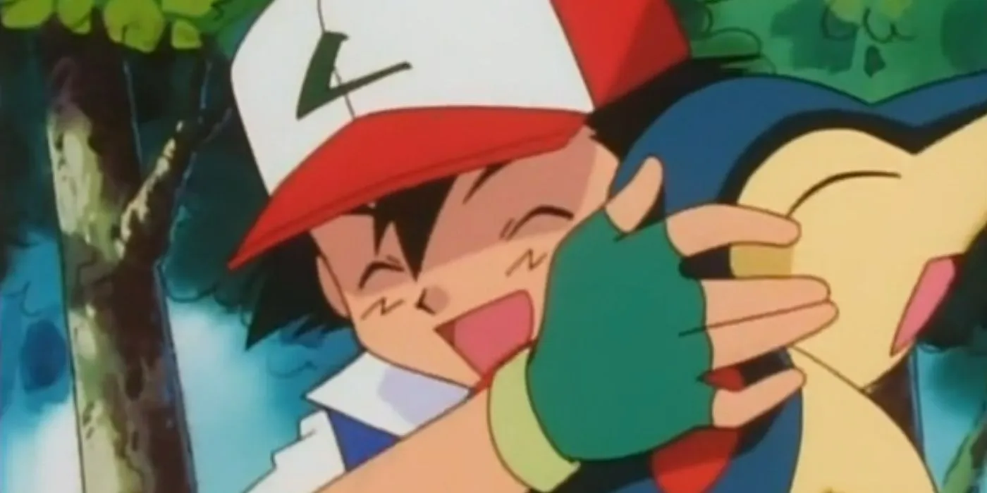 Ash serre dans ses bras son Cyndaquil nouvellement acquis