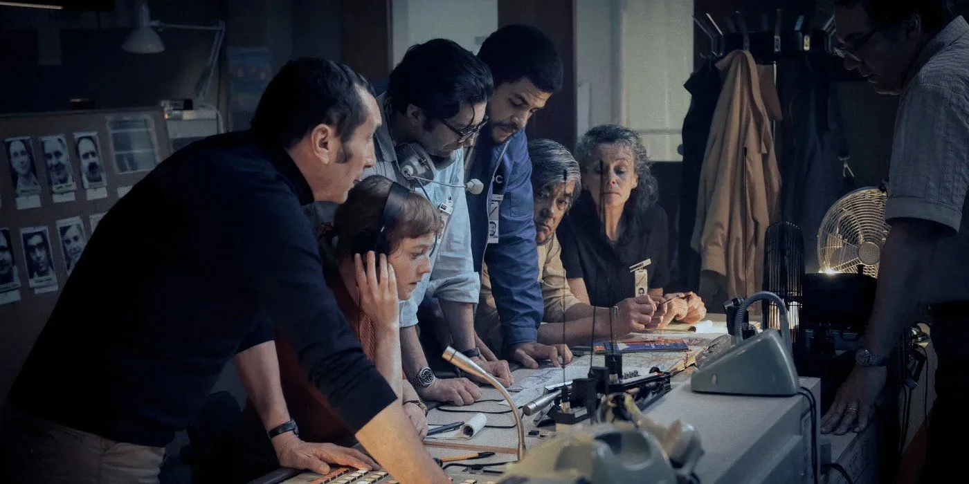 Group discussing events at a table in September 5