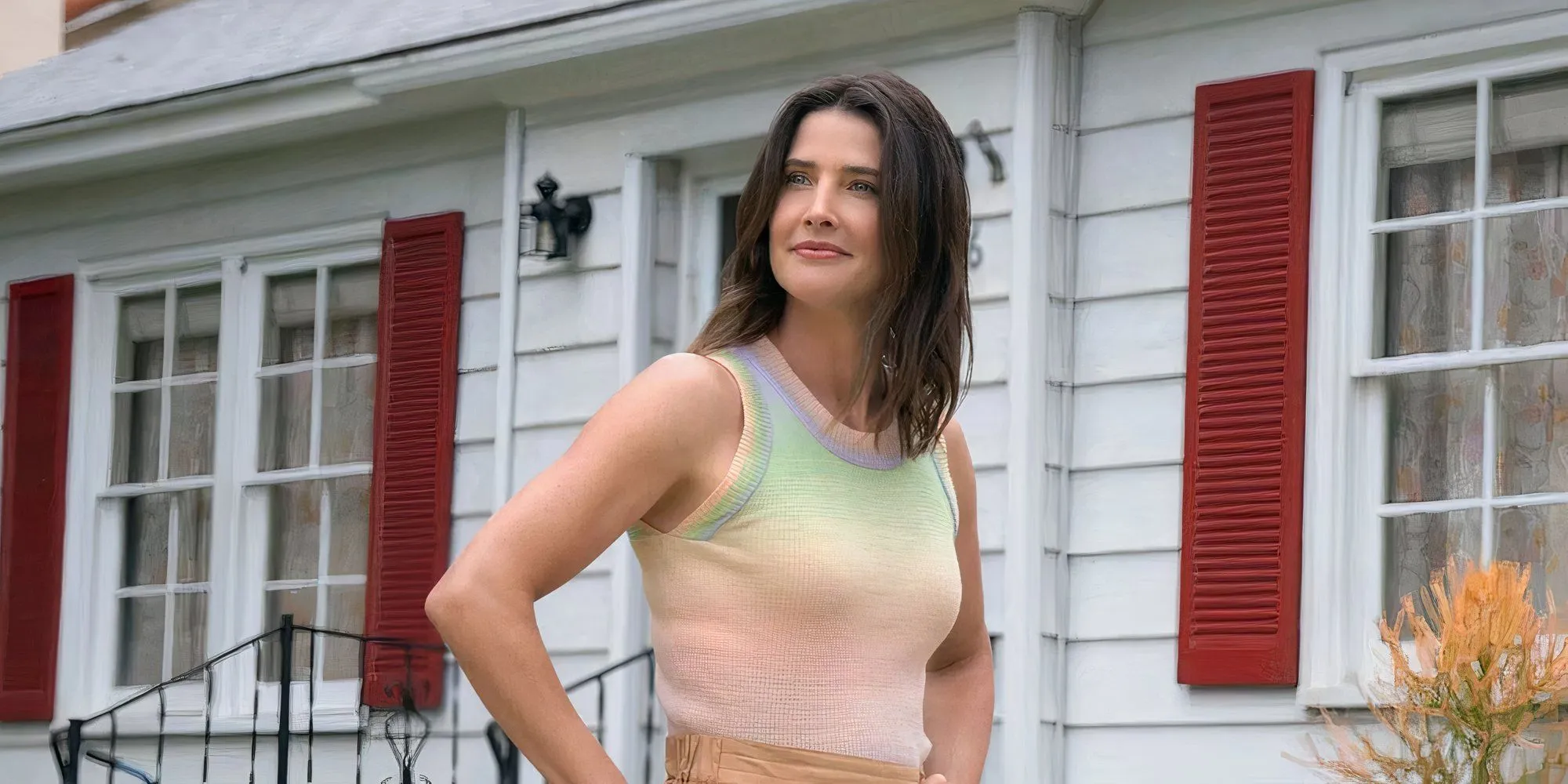 Cobie Smulders as Sofi standing in front of her house in Shrinking