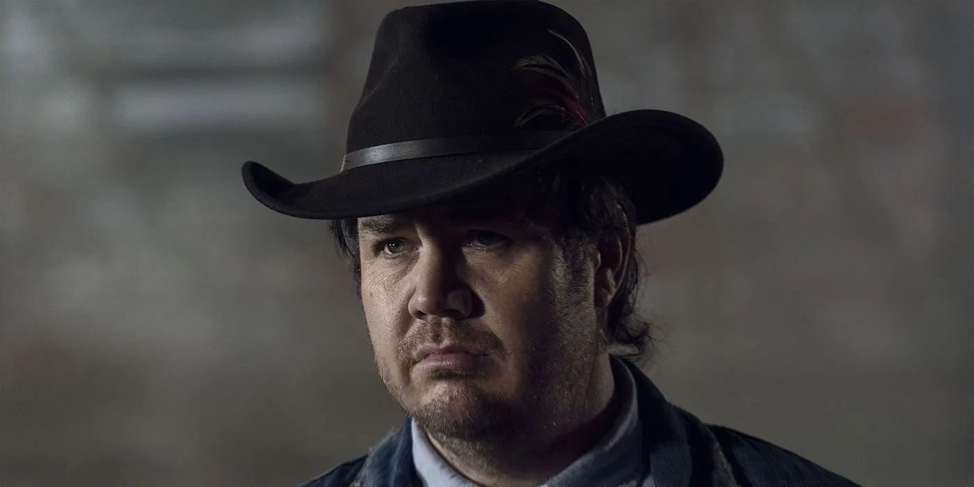 Eugene de The Walking Dead usando um chapéu de cowboy.