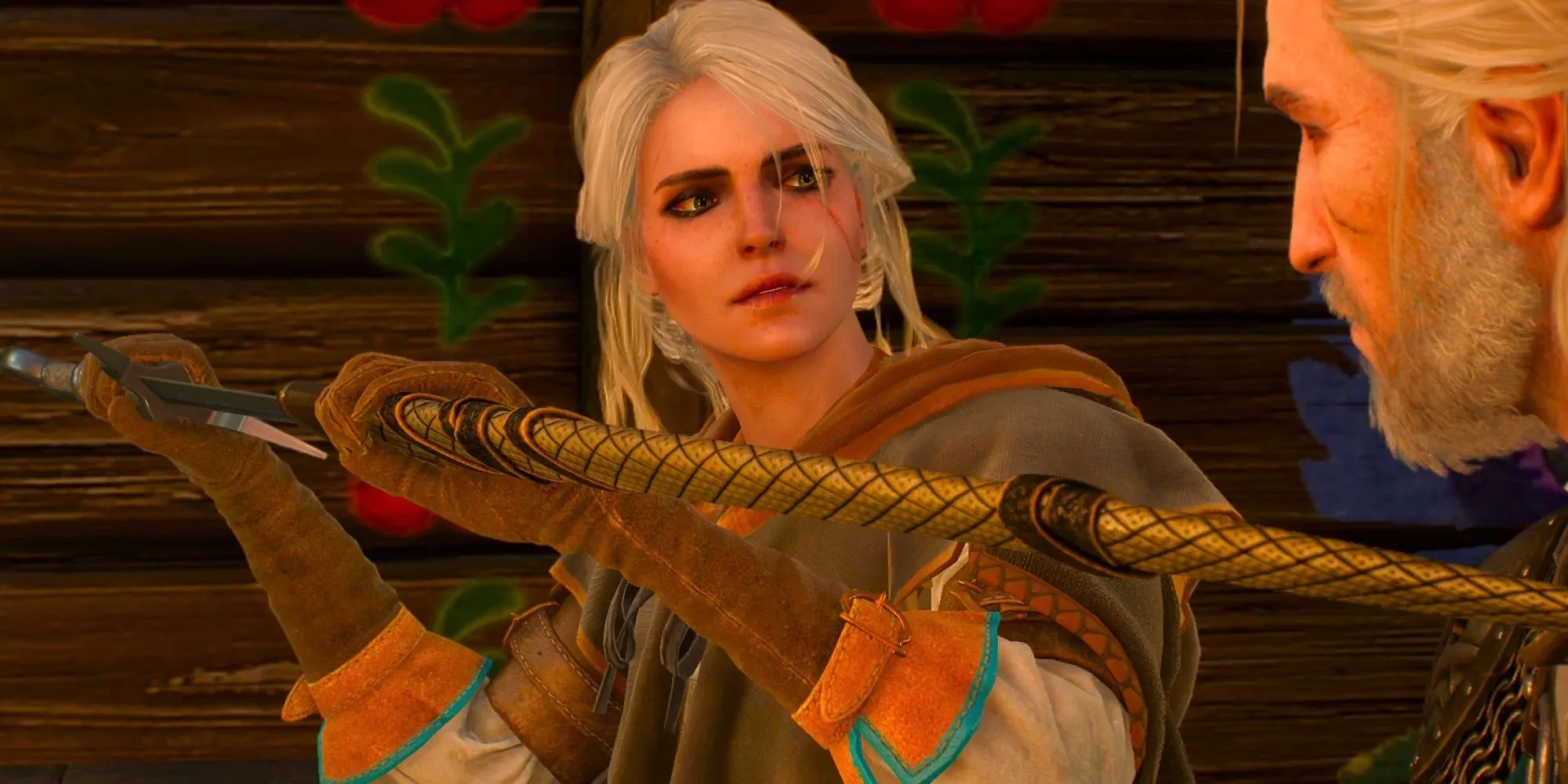 Ciri dégaine l'épée de Geralt avec admiration.