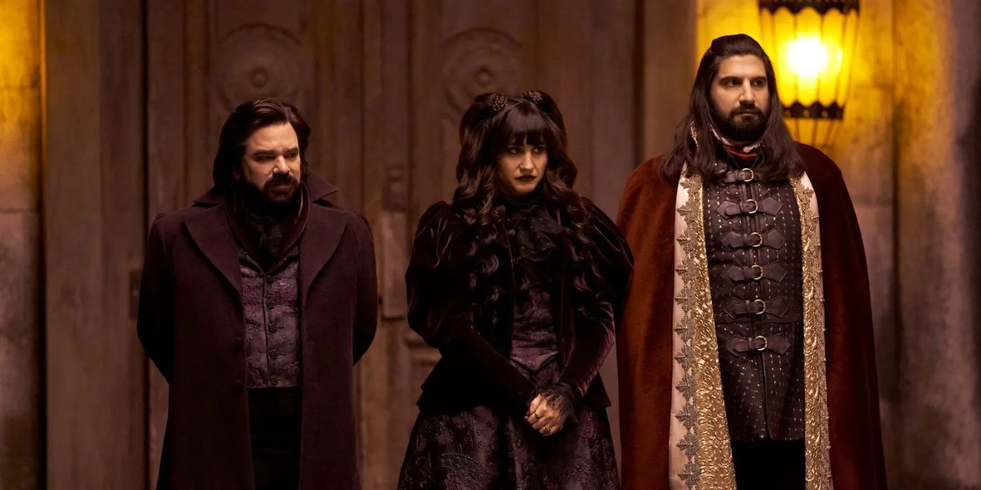 Nadya, Lazlo, and Nandor look dejected while standing by the door in What We Do In The Shadows