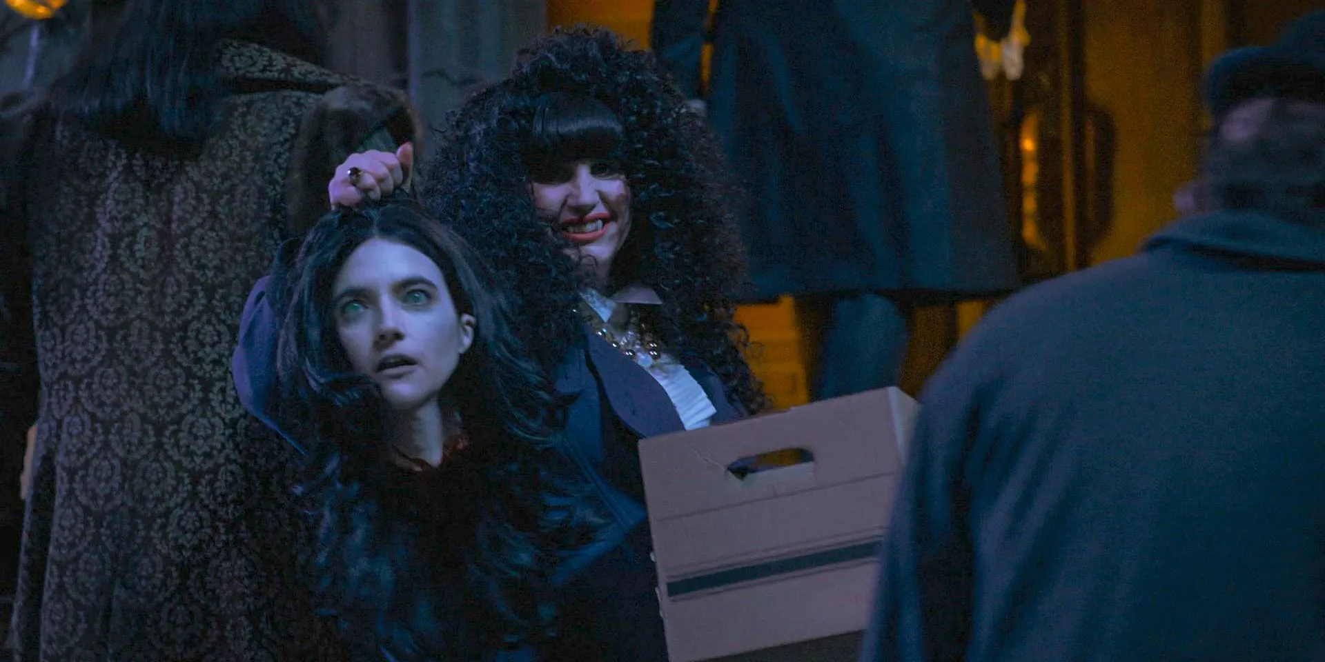 Nadja (Natasia Demetriou) holds Lisa's decapitated head in What We Do in the Shadows Season 6 Ep 10