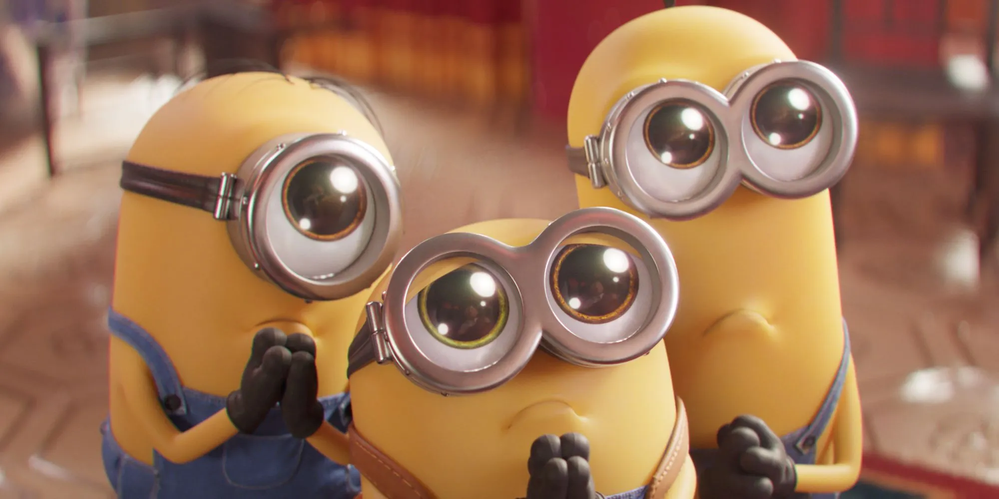 Tre Minion con espressioni tristi in Minions: Rise of Gru