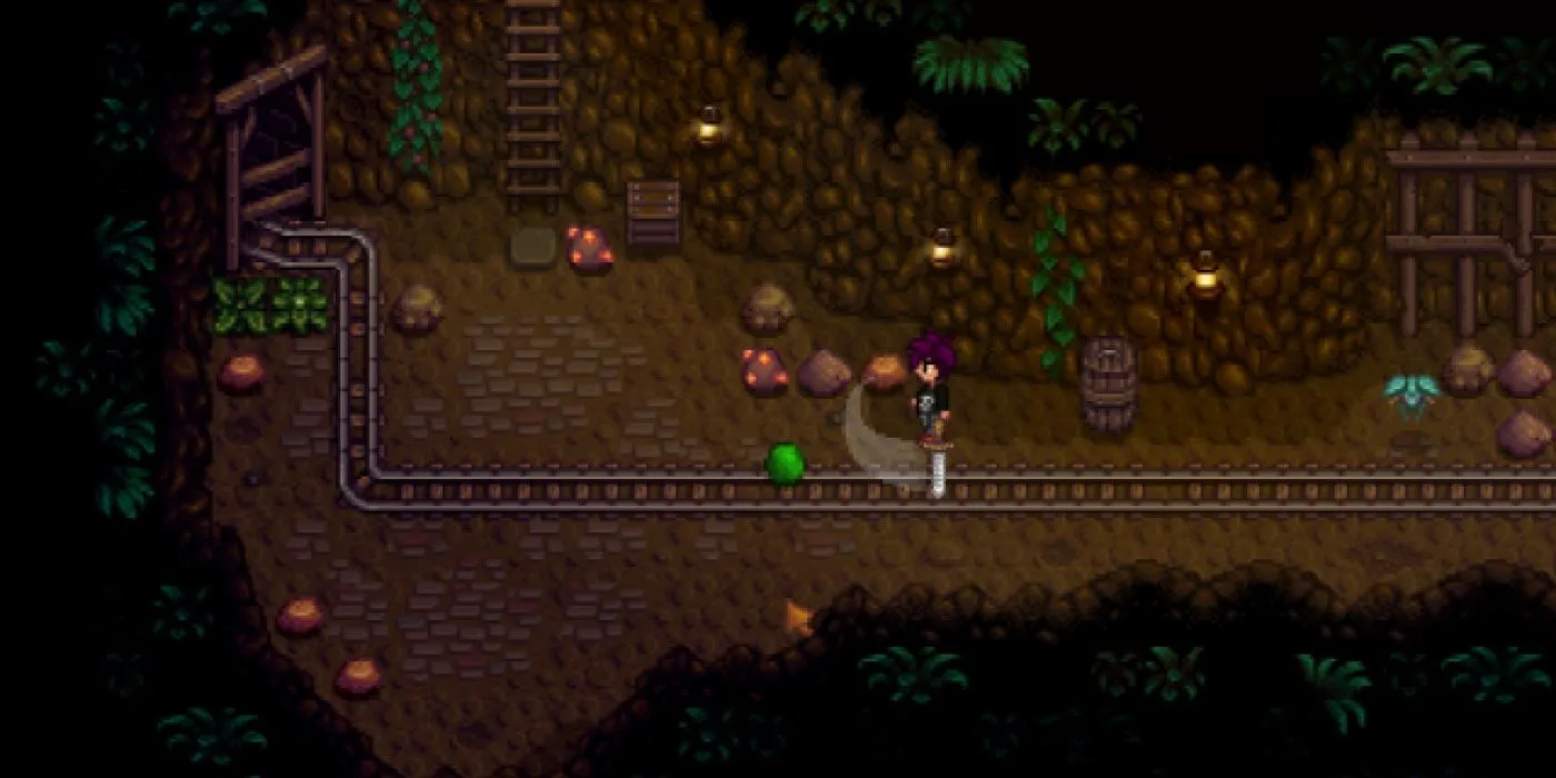 A character swings a sword at a green slime in the mines from Stardew Valley. A character swings a sword at a green slime in the mines from Stardew Valley.