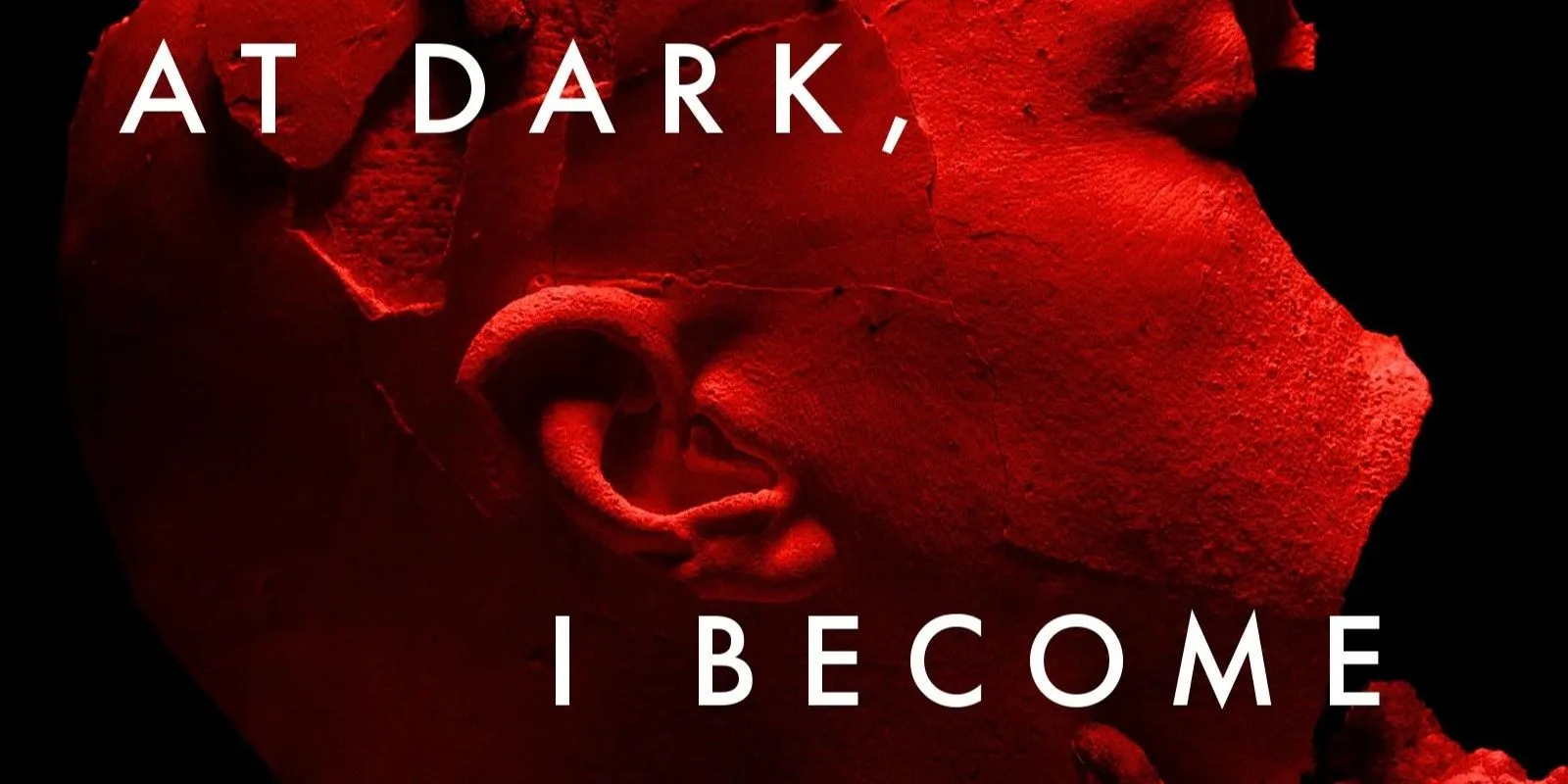 At Dark I Become Loathsome cover featuring parts of a red-stony face