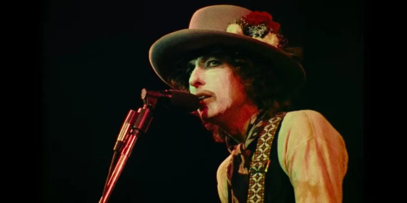 Bob Dylan performing on stage in makeup in a still from Renaldo and Clara