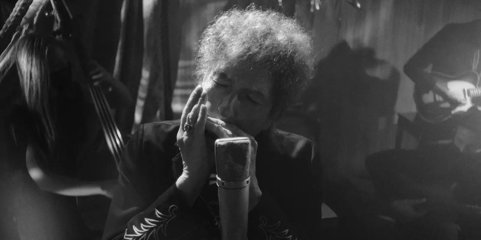 Bob Dylan playing the harmonica for the cover of his 2023 album Shadow Kingdom.