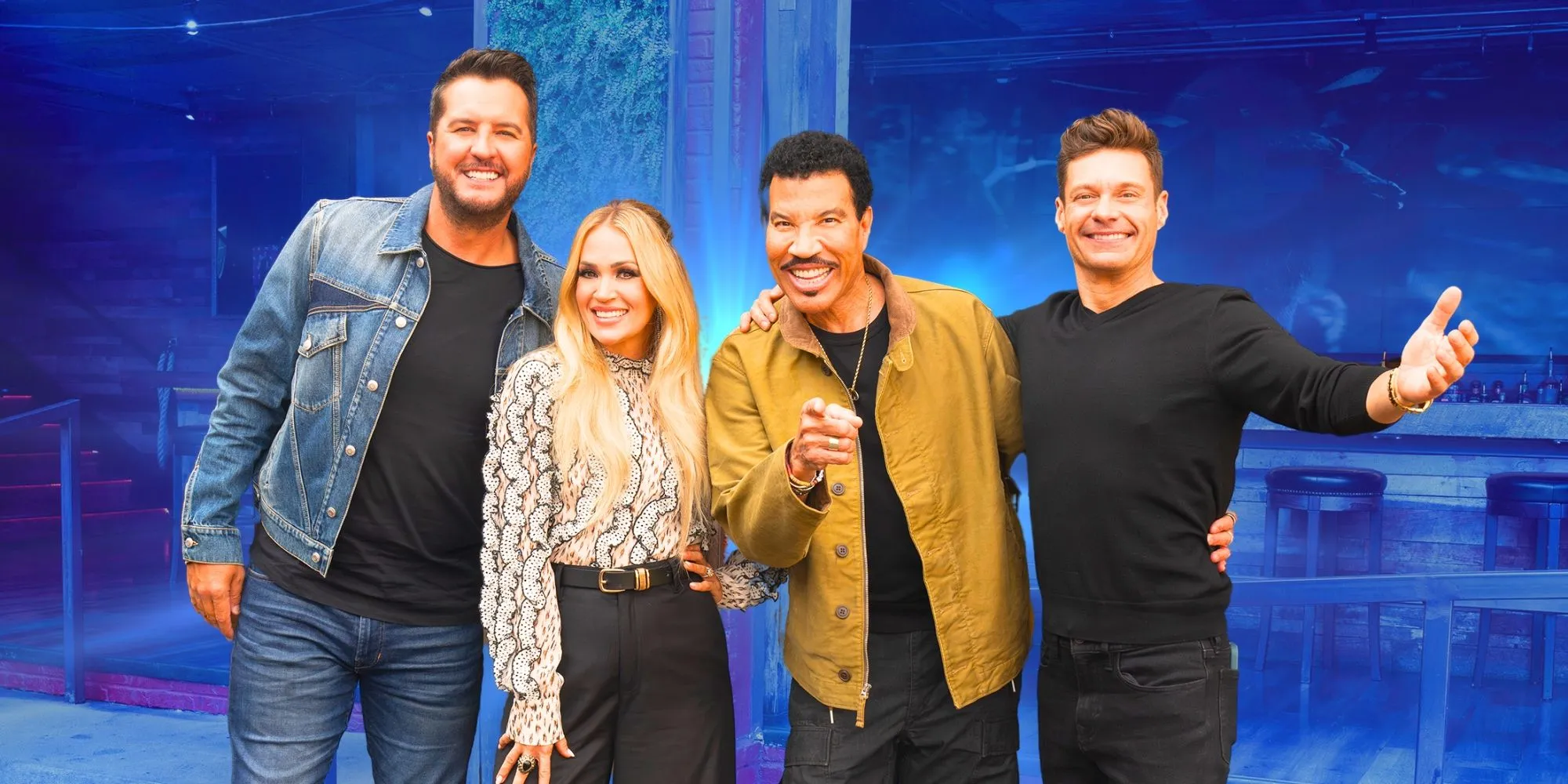 American Idol's judges and host smiling together American Idol's judges and host smiling together