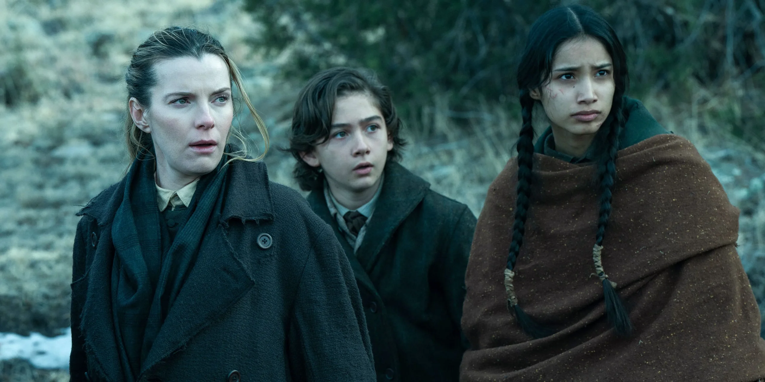 three characters in American Primeval standing together outside