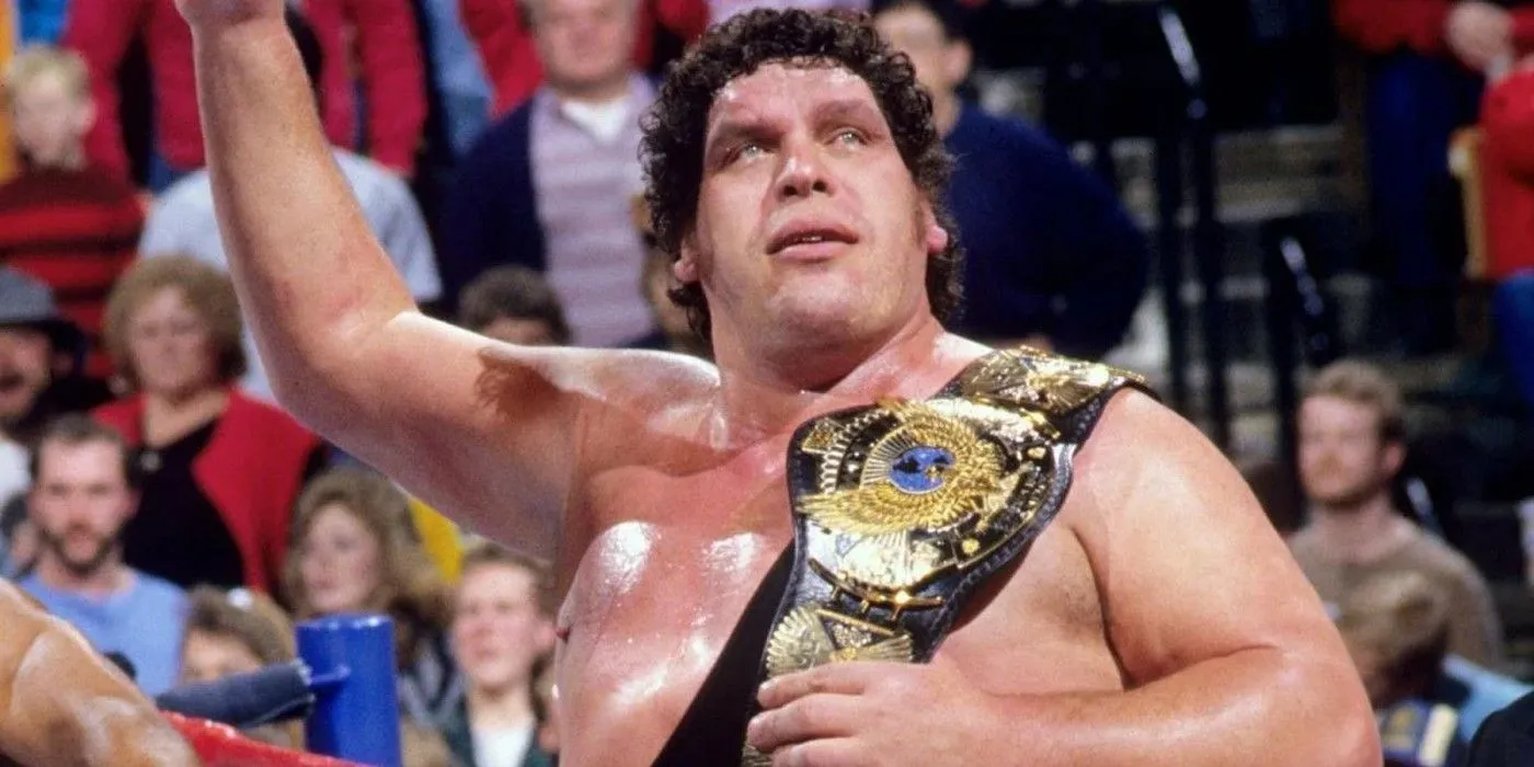 Andre the Giant holding the WWE Championship after defeating Hulk Hogan at The Main Event