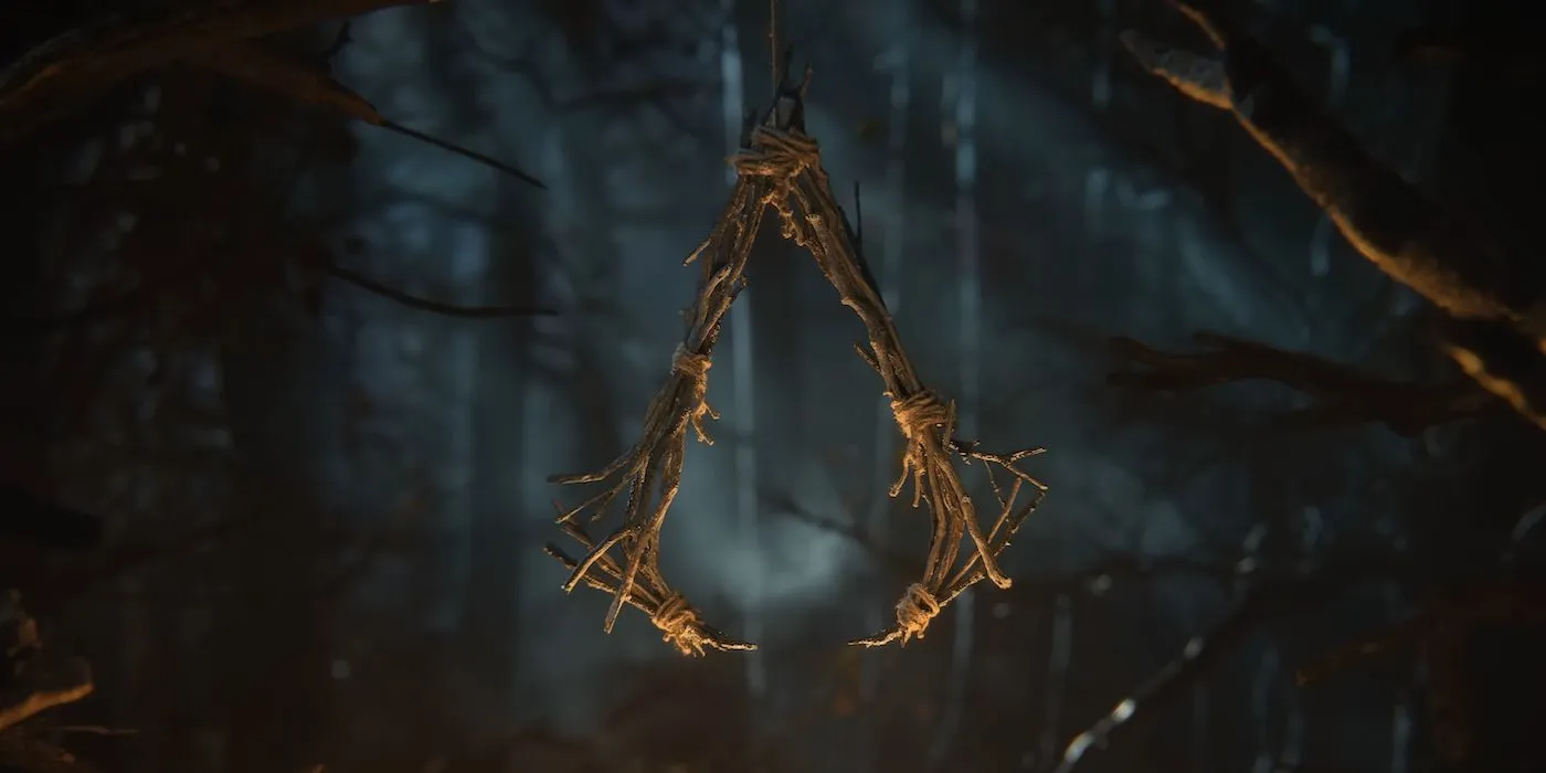 The logo for Assassin's Creed Hexe, turning the franchise's iconic logo into a unique wooden charm.
