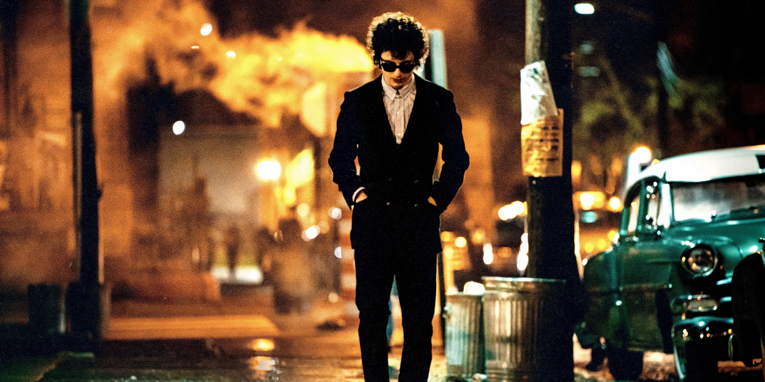 Bob Dylan on the street in A Complete Unknown Bob Dylan on the street in A Complete Unknown