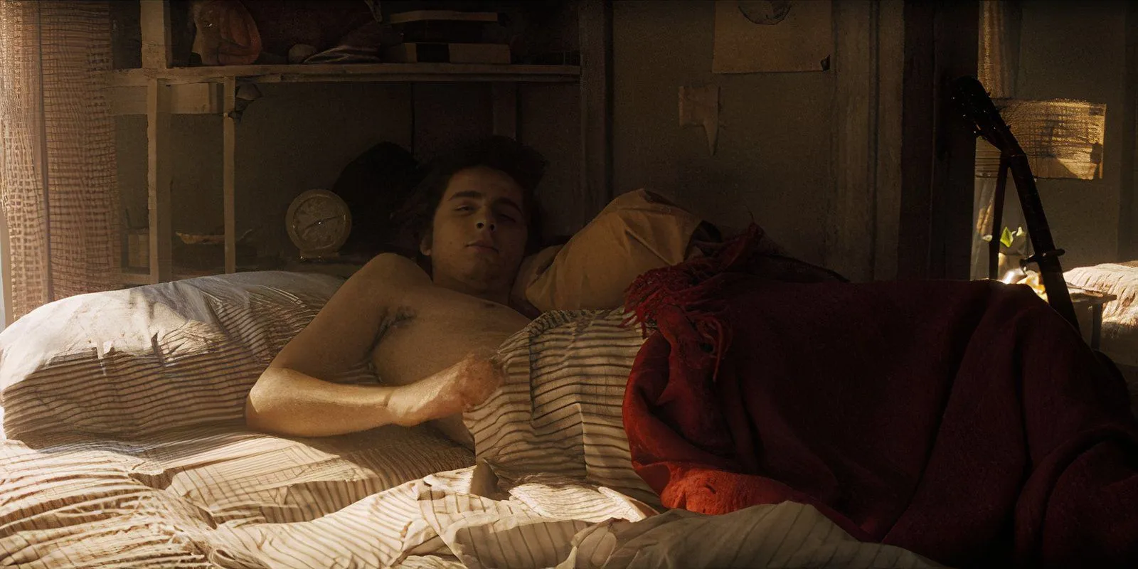 Bob Dylan wakes up in bed in A Complete Unknown Bob Dylan wakes up in bed in A Complete Unknown