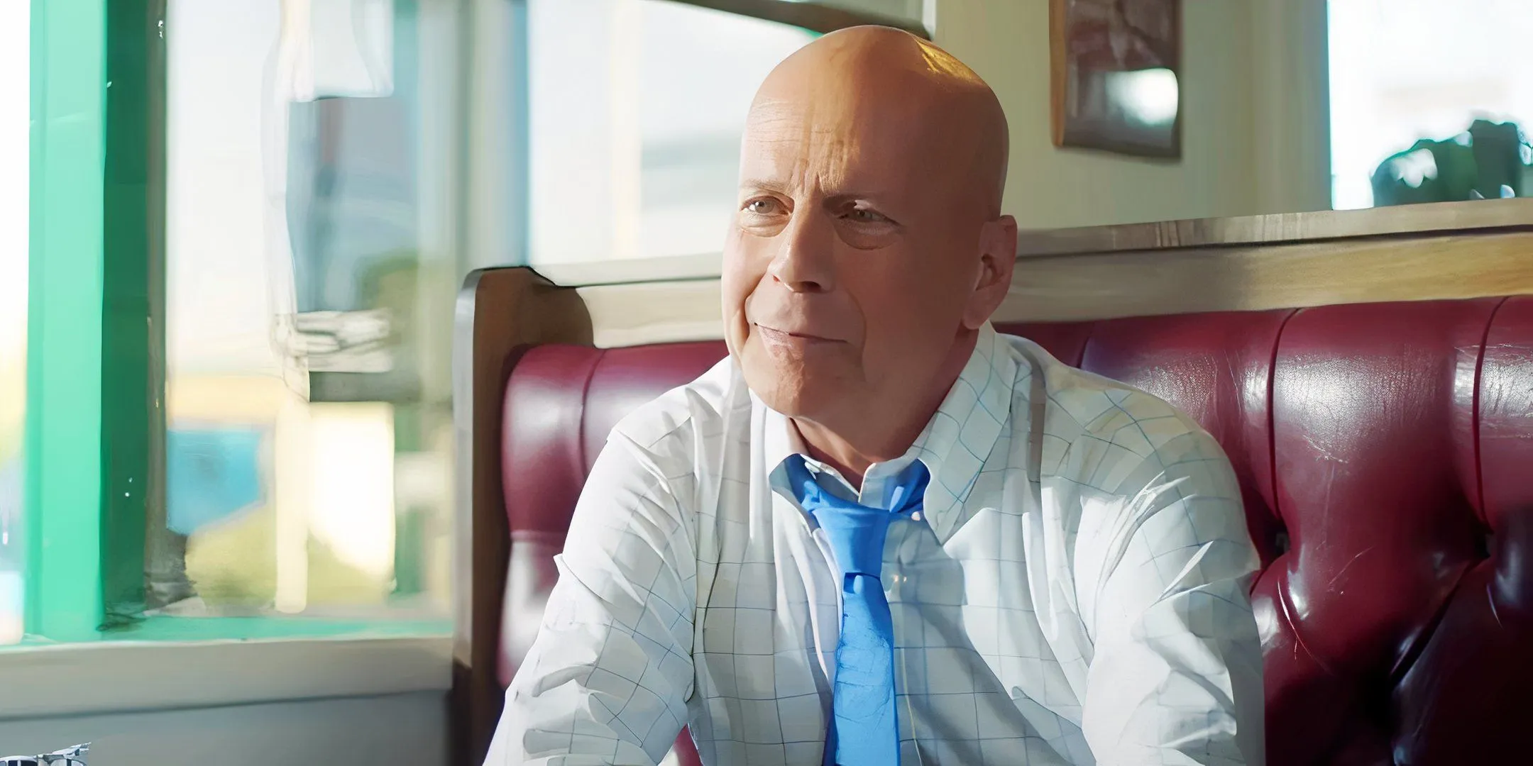 Bruce Willis smiling at a diner booth in Midnight in the Switchgrass Bruce Willis smiling at a diner booth in Midnight in the Switchgrass