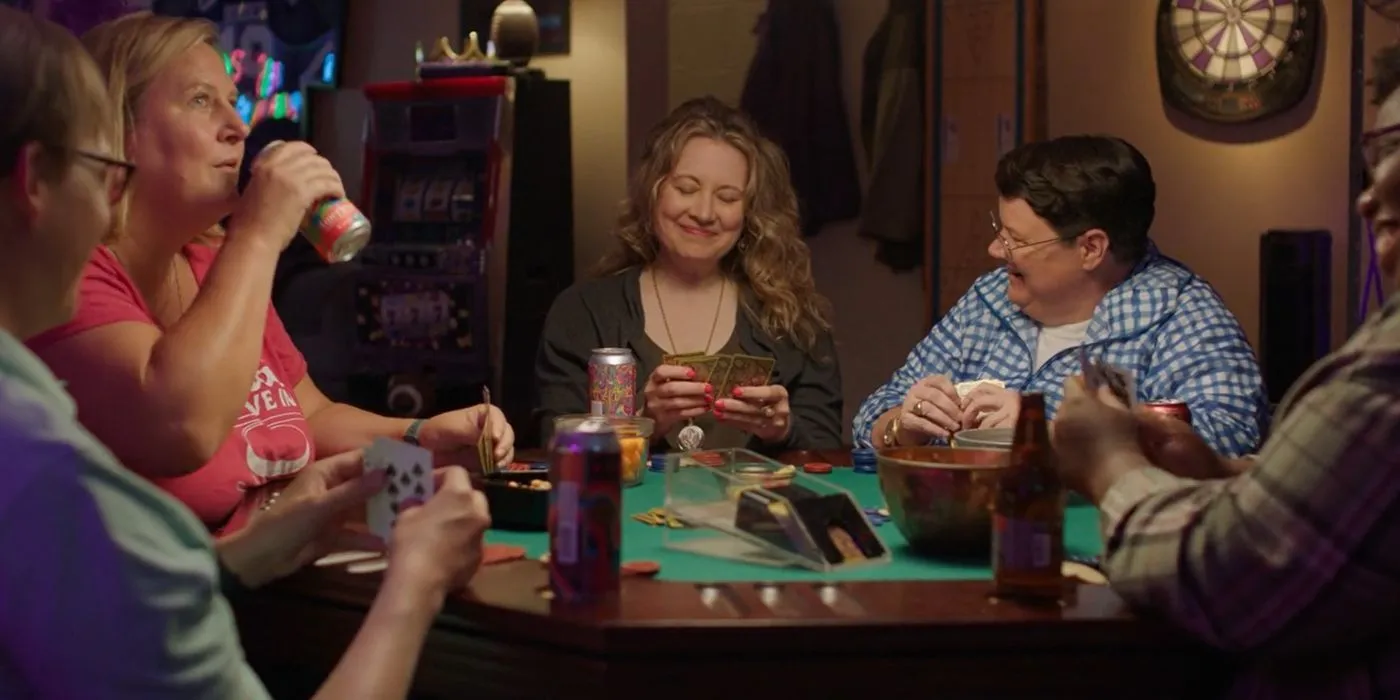 A scene from Somebody Somewhere with characters playing poker. A scene from Somebody Somewhere with characters playing poker.