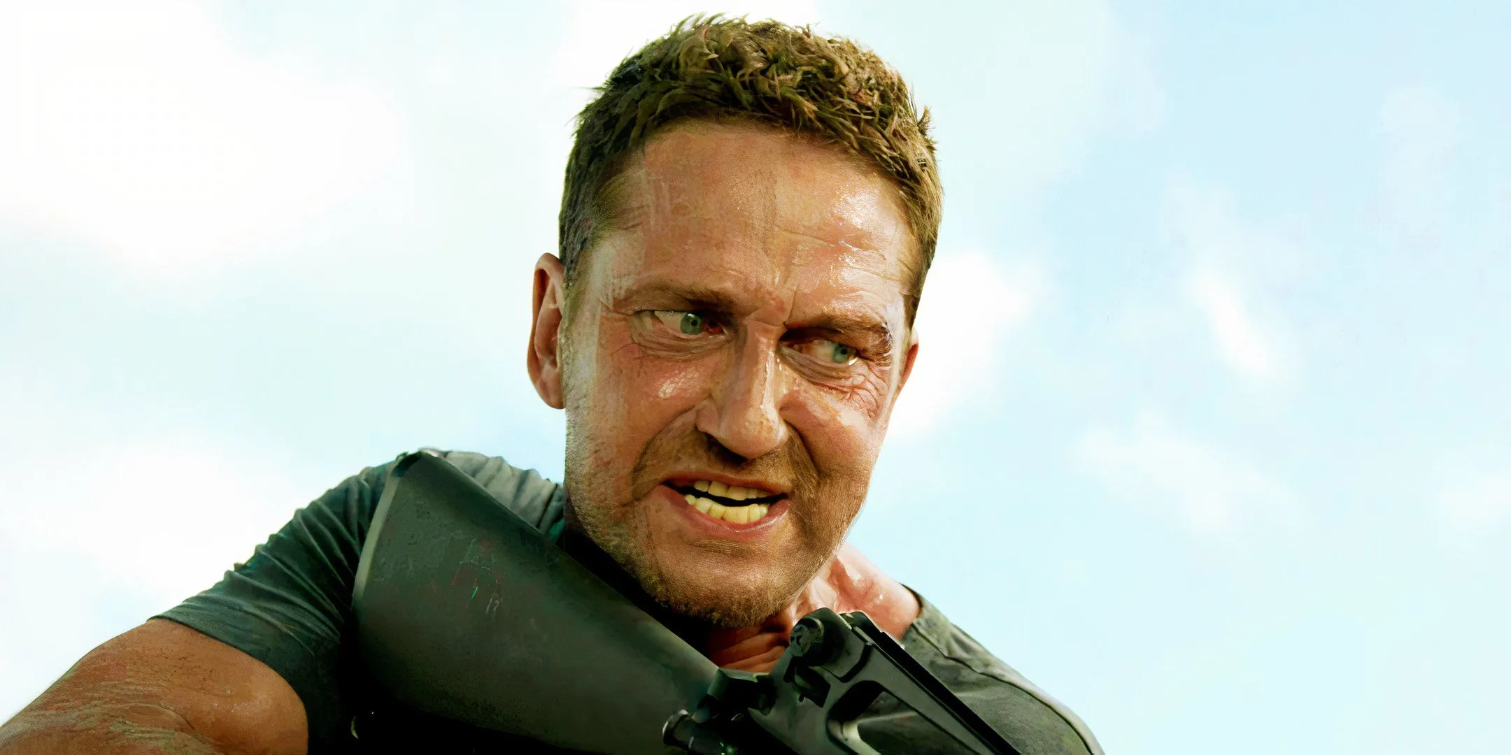 Gerard Butler wielding a rifle as Brodie Torrance in Plane Gerard Butler wielding a rifle as Brodie Torrance in Plane