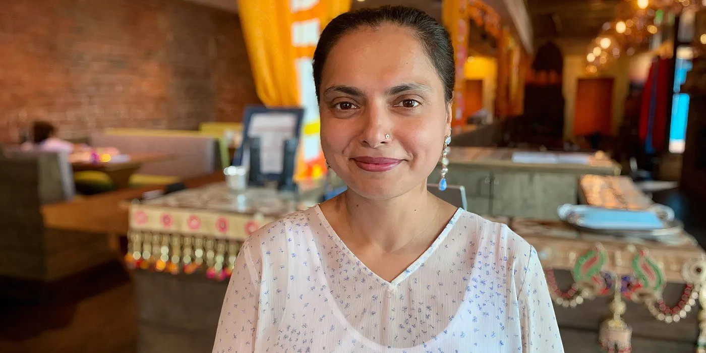 Maneet Chauhan in a restaurant dining room