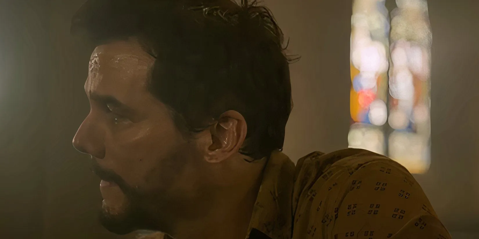 Manny sitting in a church in Dope Thief